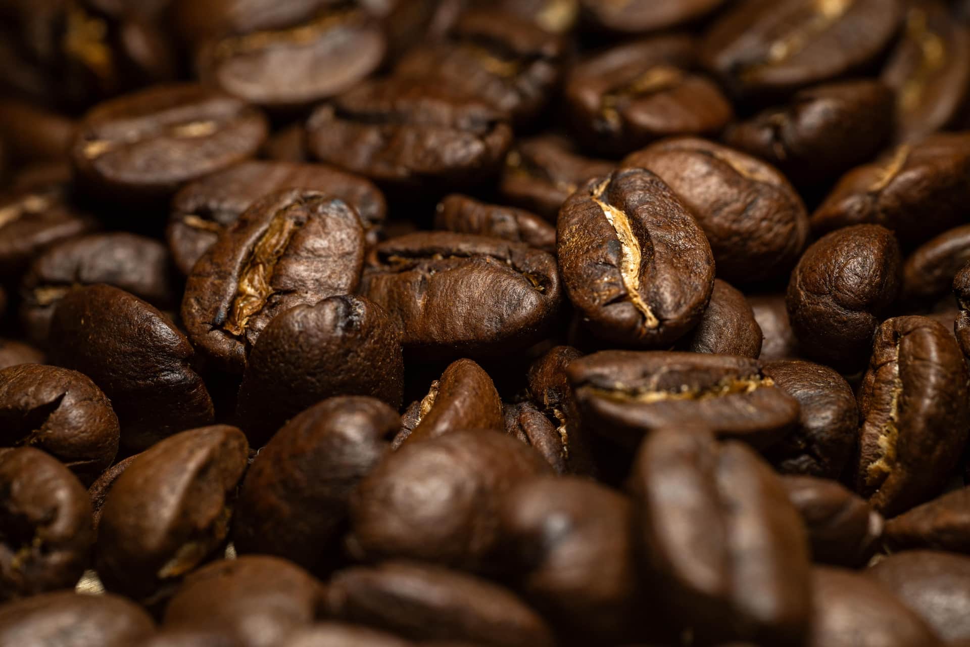 Whole coffee beans in a bowl