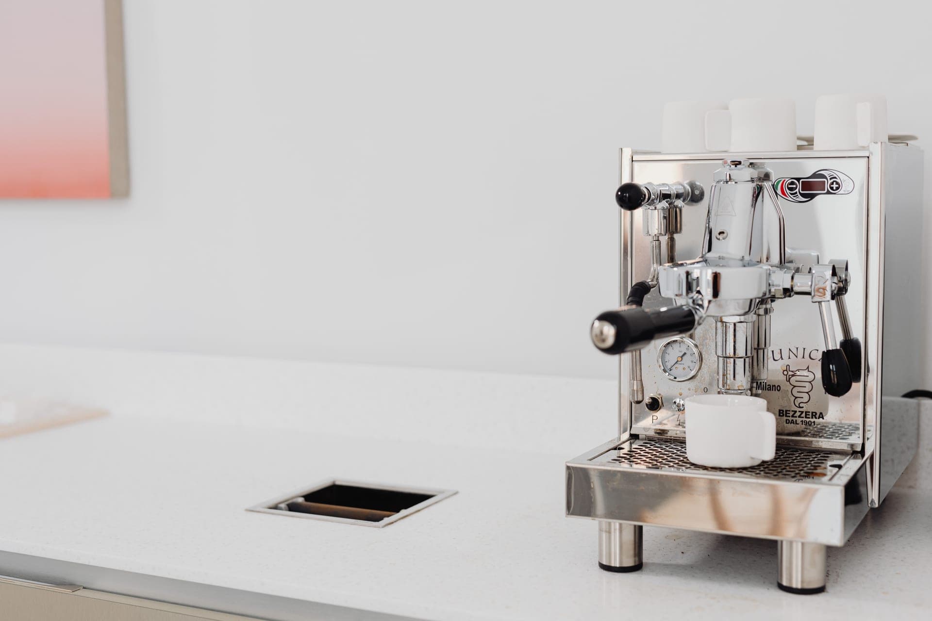 A multi-function coffee machine on a kitchen counter